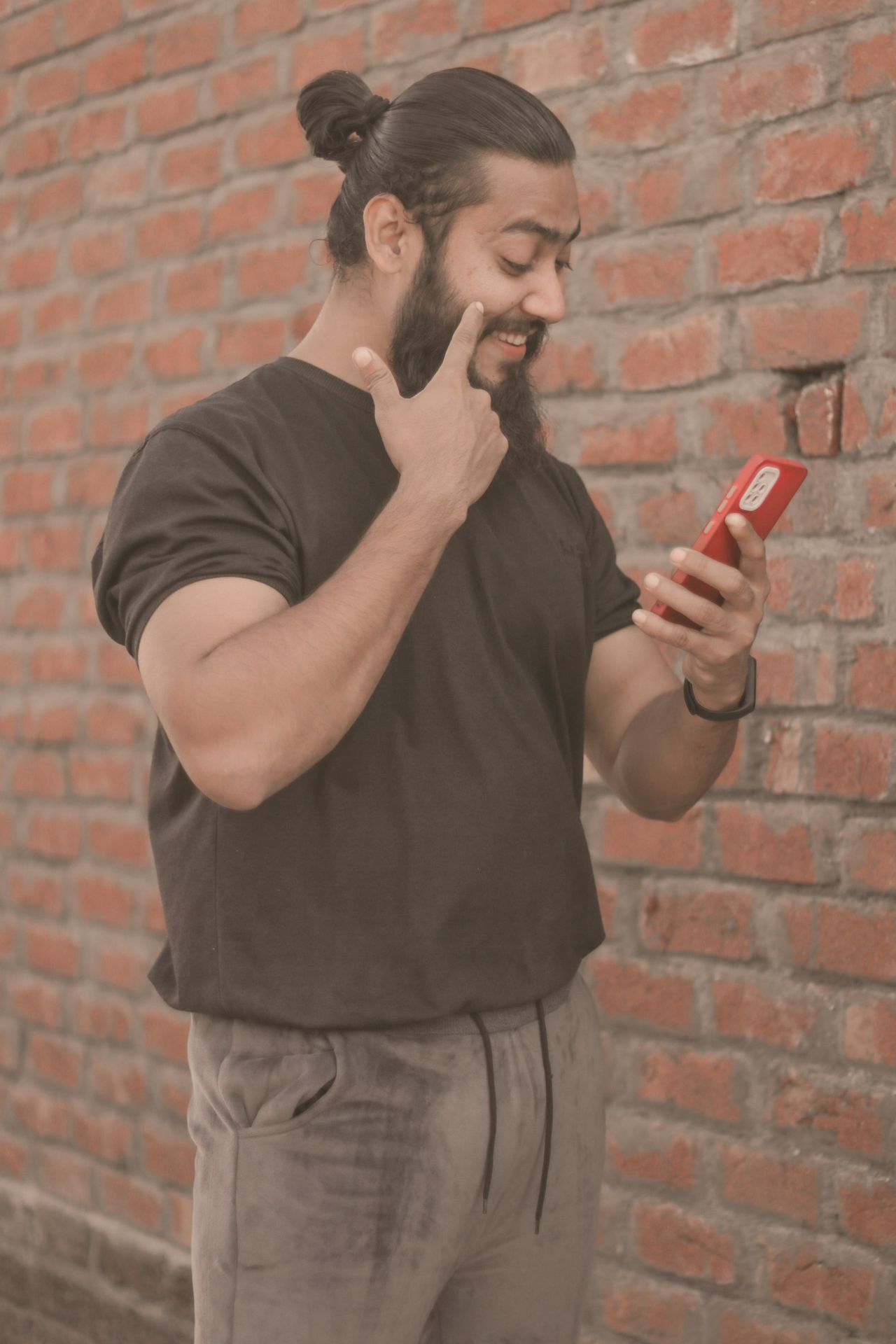 a person holding a red phone